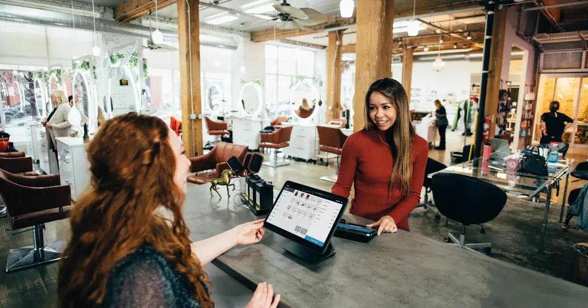 Business owners reviewing accounts on a laptop